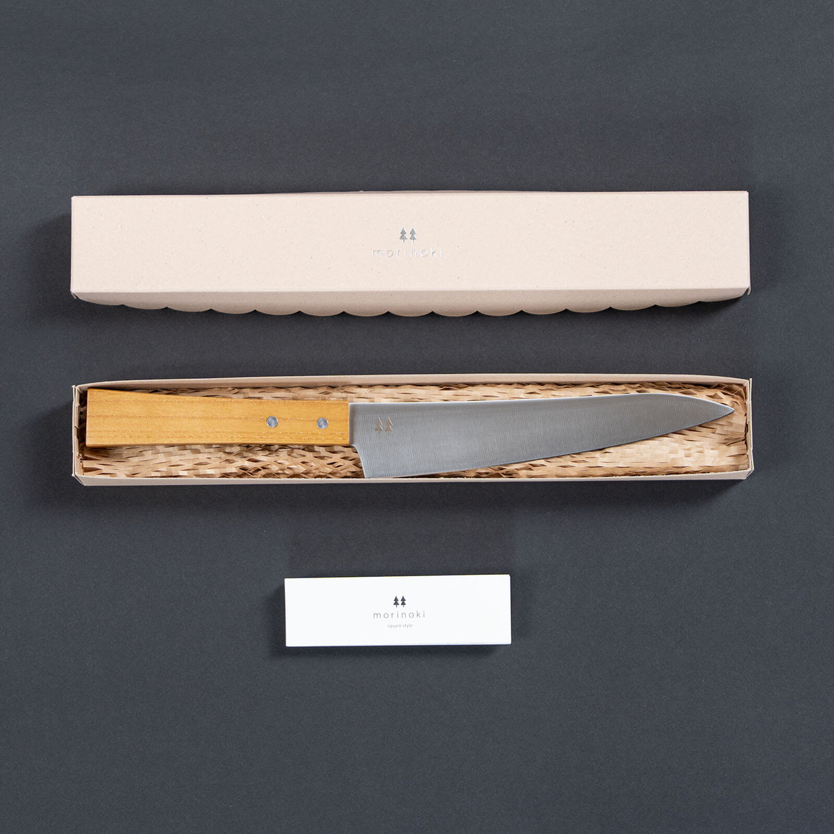 Shizuhamono Morinoki 170mm utility knife in its open box with protective packing and a leaflet