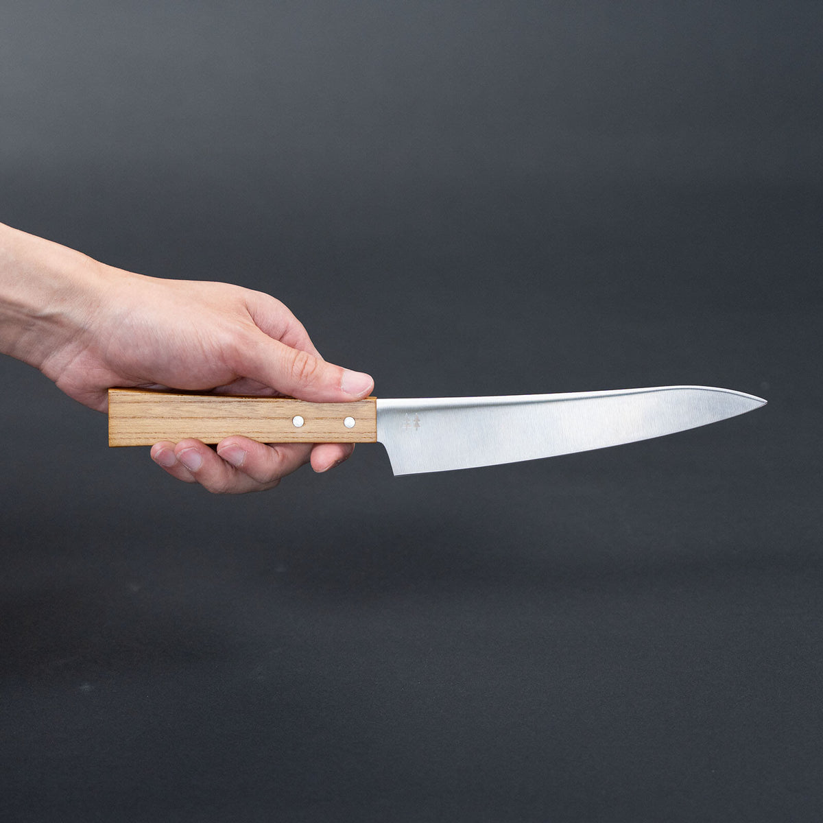 Side view of the Shizuhamono Morinoki 170mm utility knife held horizontally in one hand