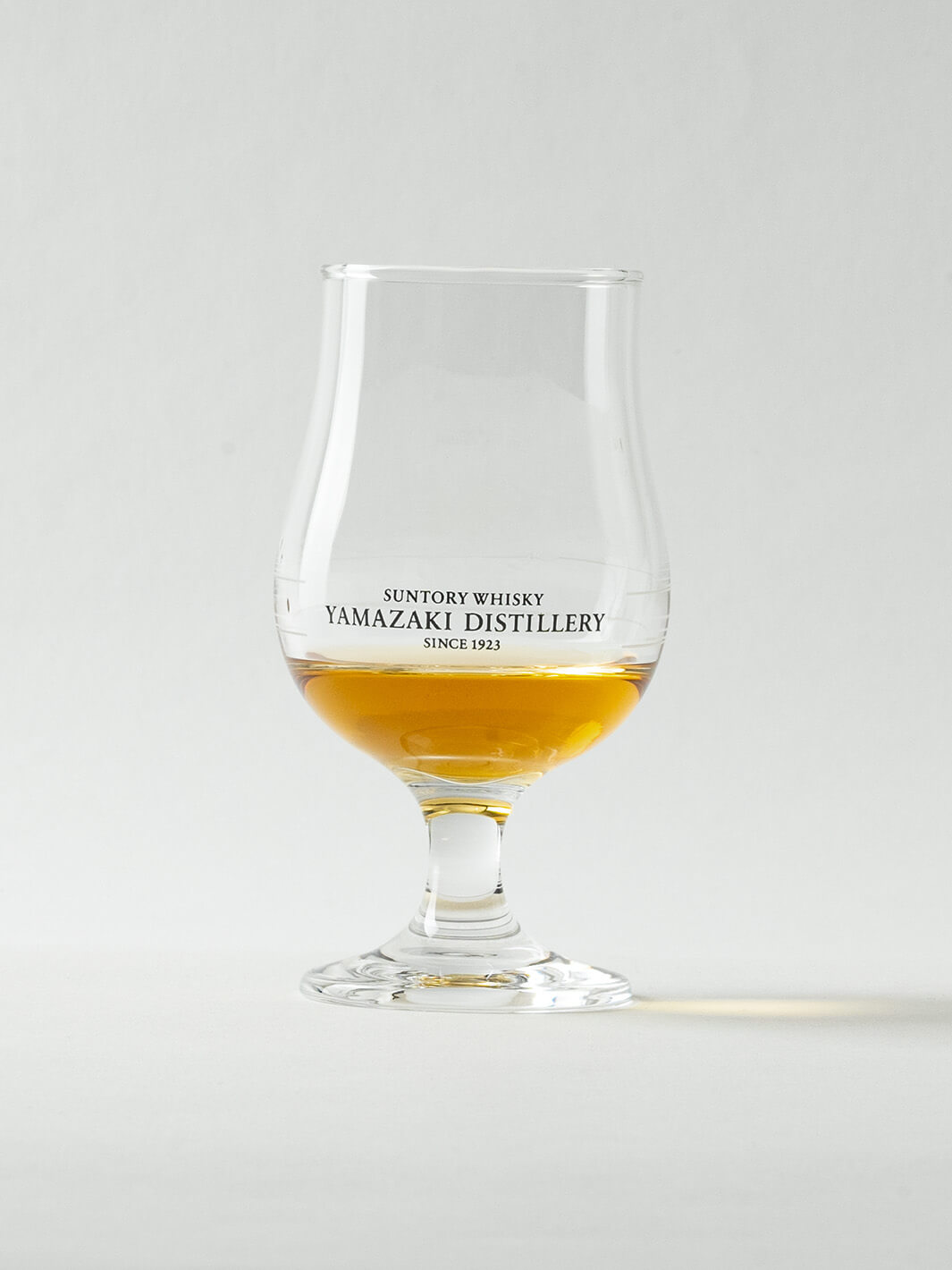 Yamazaki Japanese whiskey tasting glass with whisky, tulip-shaped