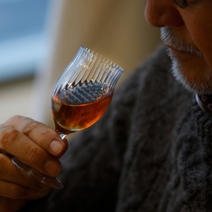 Close-up of Yamazaki × Takeo Kikuchi Fragrance Glass, capturing the rich aroma of whiskey during a tasting.