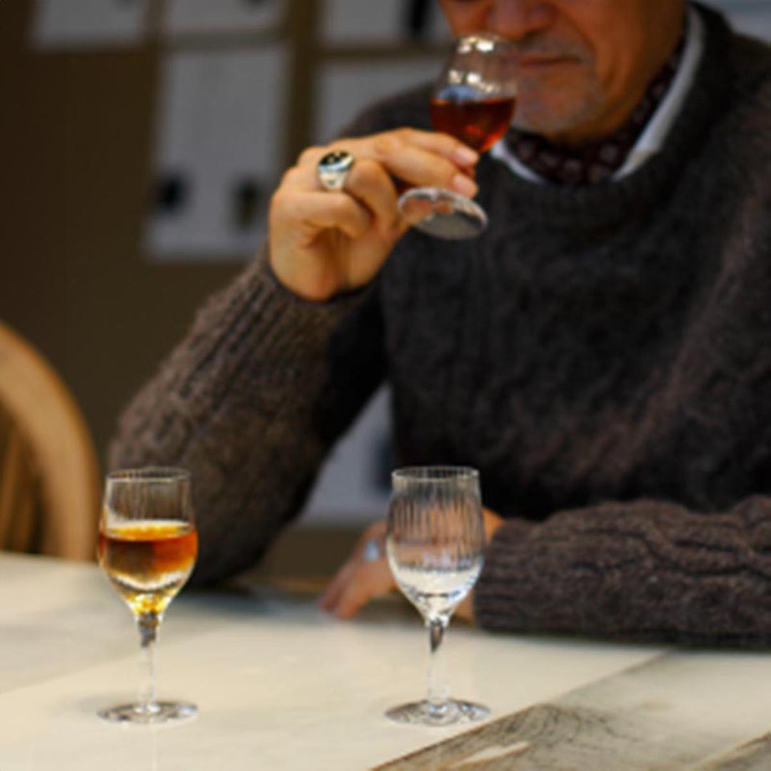 Close-up of Yamazaki × Takeo Kikuchi Fragrance Glass, capturing the rich aroma of whiskey during a tasting.